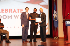 Dr. Brumley and LDOE Chief of Staff Ken Bradford presented future servicemembers with a challenge coin, pocket Constitution, and certificate recognizing their upcoming service.