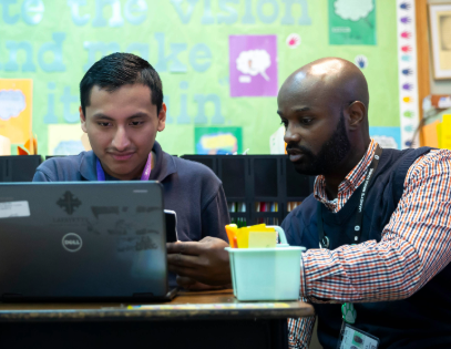 Teacher working with student